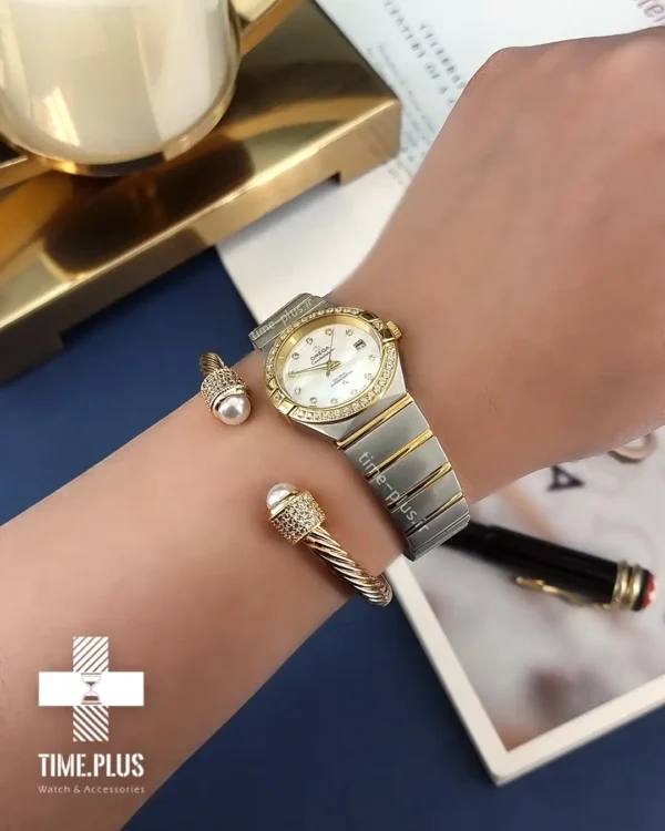 ساعت مچی زنانه امگا نقره ای و طلایی